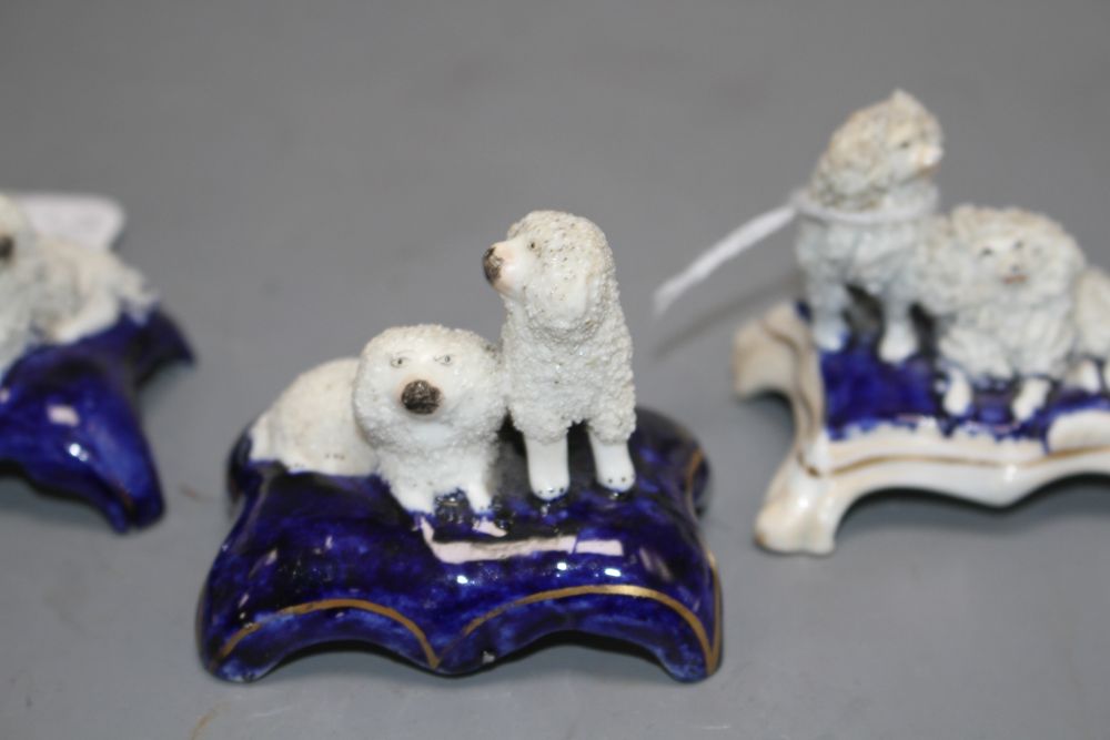 Five Staffordshire porcelain toy groups of poodles, c. 1840-50, the majority by Dudson, H. 4.2 - 5.2cm